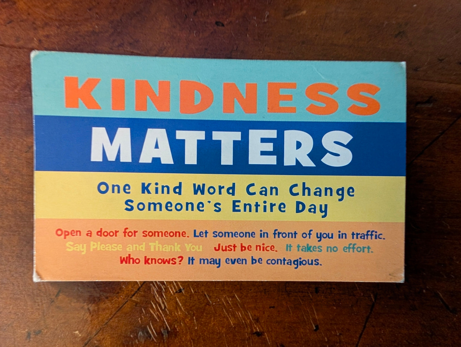 The front of the "Kindness Matters" card Miss Mary hands out, reading "One Kind Word Can Change Someone's Entire Day."
